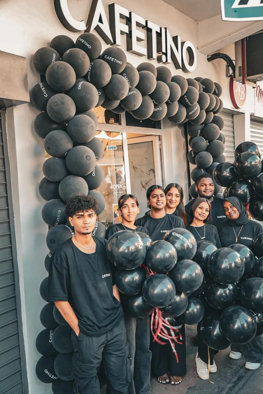 The Cafetino team in front of the shop